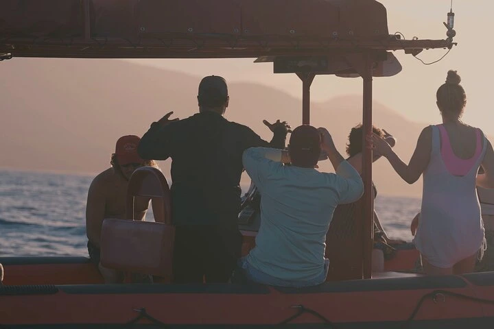 Snorkelers in crystal-clear waters at Molokini Crater